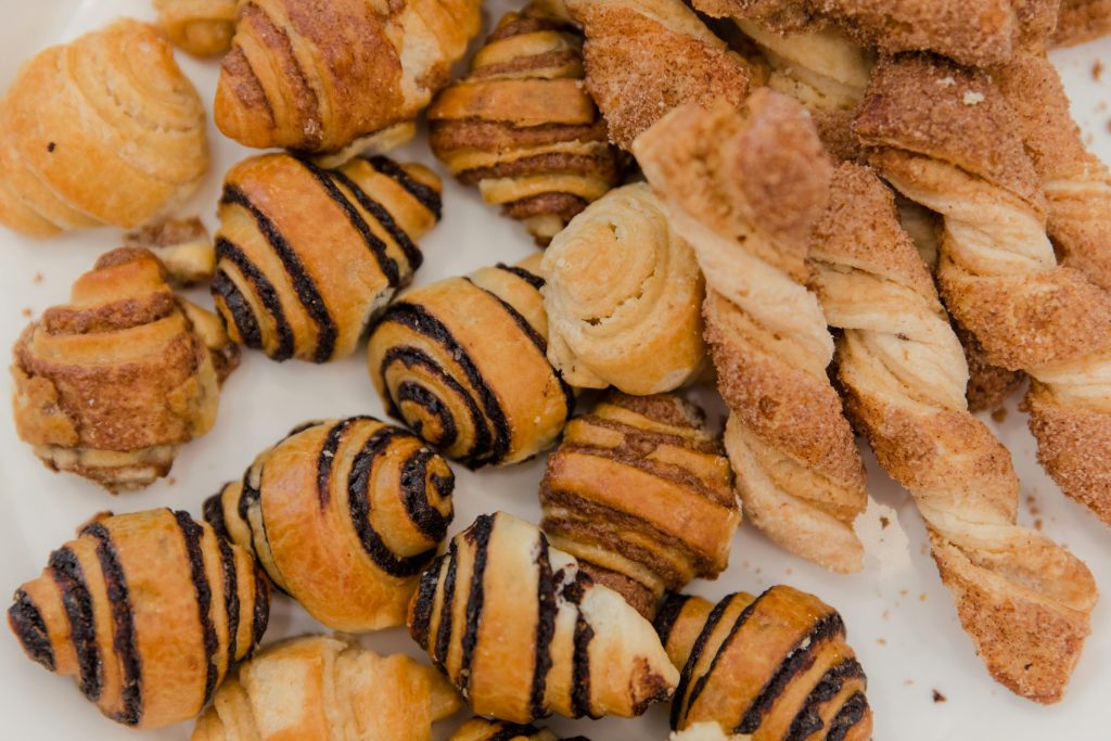Delicious assortment of pastries including chocolate-filled croissants and cinnamon twists.